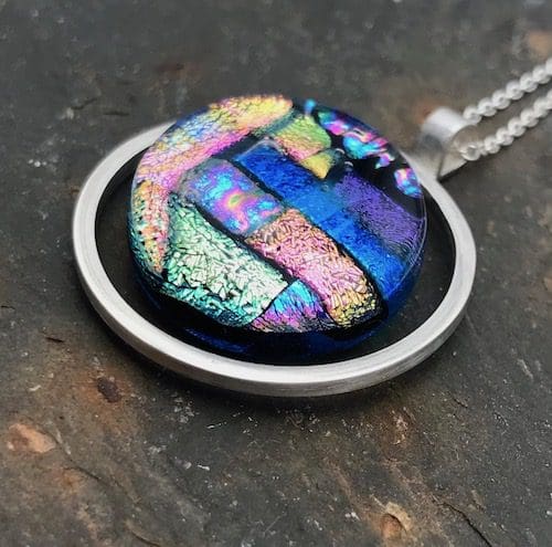 Mosaic dichroic glass circle within an eco-silver circle pendant. - Image 5