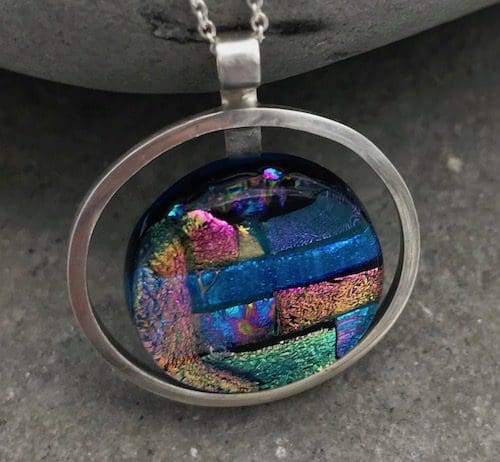 Mosaic dichroic glass circle within an eco-silver circle pendant. - Image 4