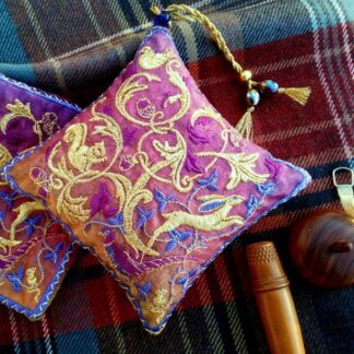 Rich warm magenta Woodland embroidered lavender bag, with running hare in gold stitches