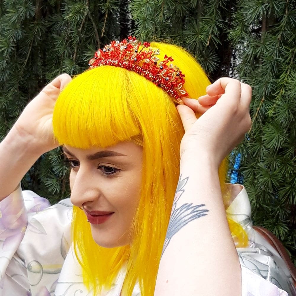 red and gold radiance tiara being put on