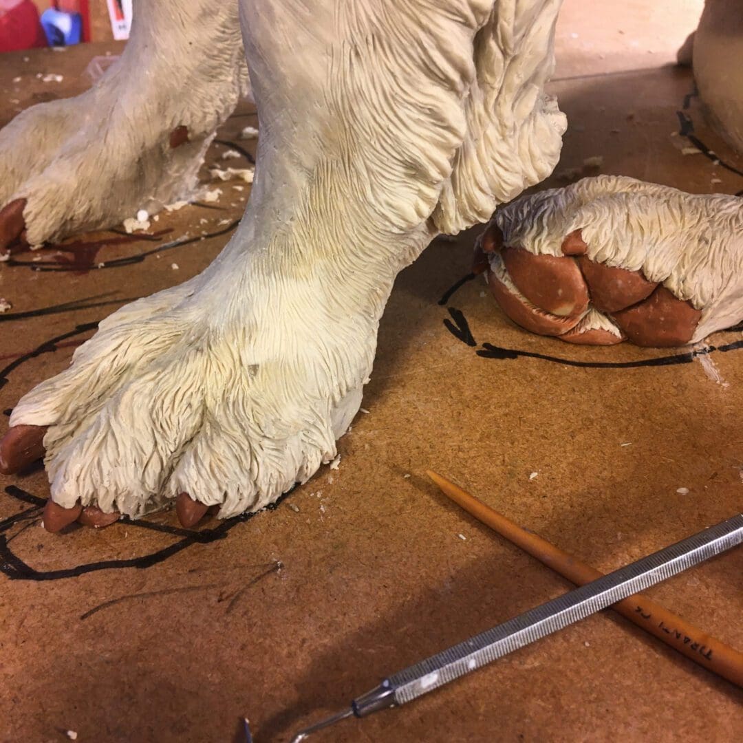 The paws of Max the miracle dog sculpture in wax