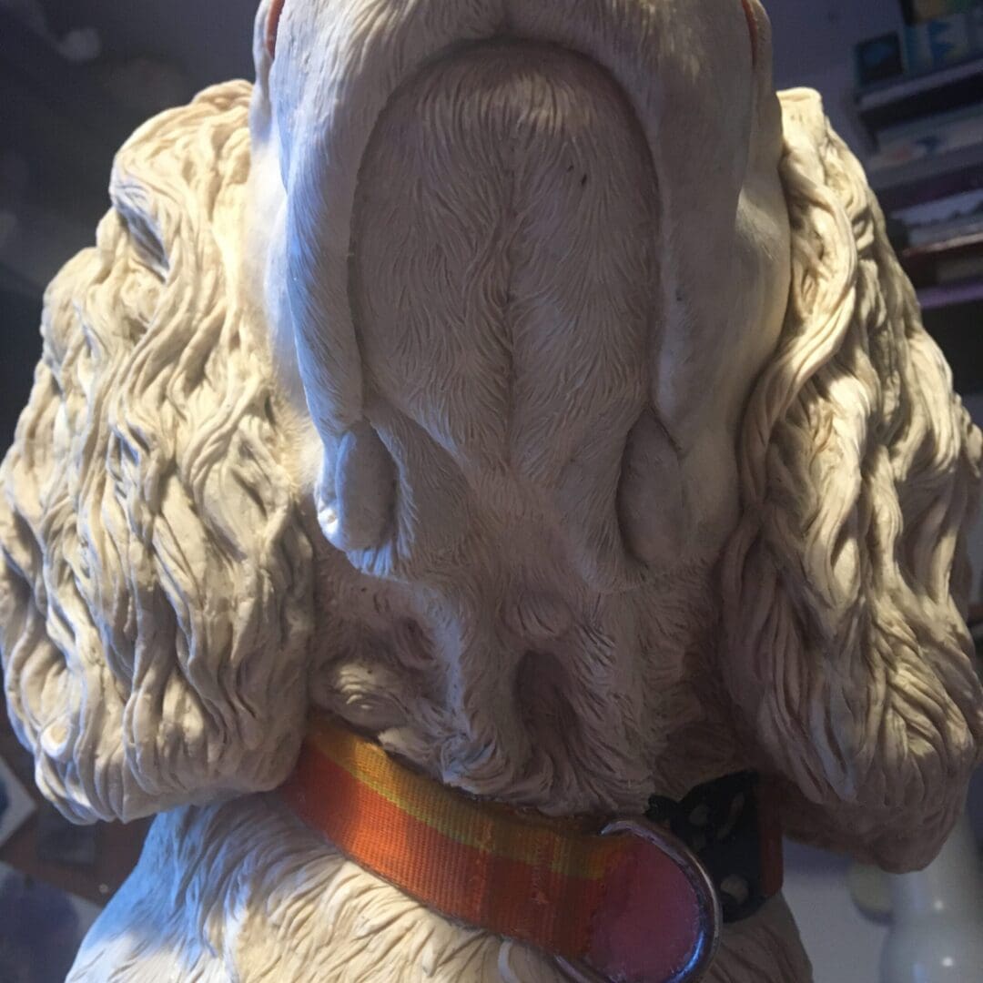 Underneath the chin of the original sculpture of Max the miracle dog by Kirsty Armstrong Sculpture