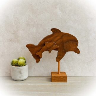 Handcrafted wooden interlocking dolphins made from Sapele with Oak base