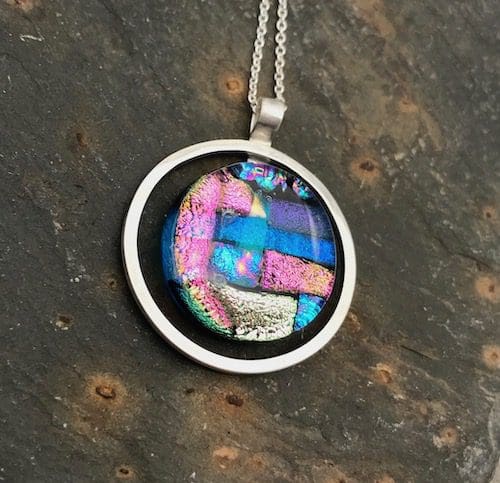 Mosaic dichroic glass circle within an eco-silver circle pendant. - Image 8