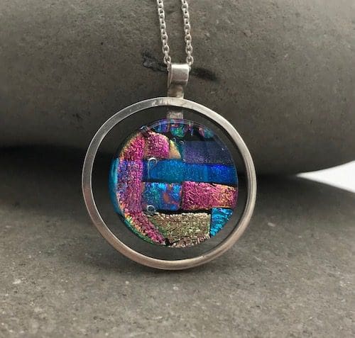 Mosaic dichroic glass circle within an eco-silver circle pendant. - Image 7