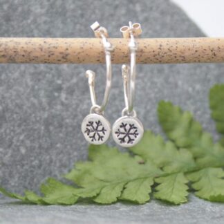 Silver snowflake hoop earrings