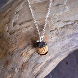 Copper and yellow lava rock bead pendant on a silver chain