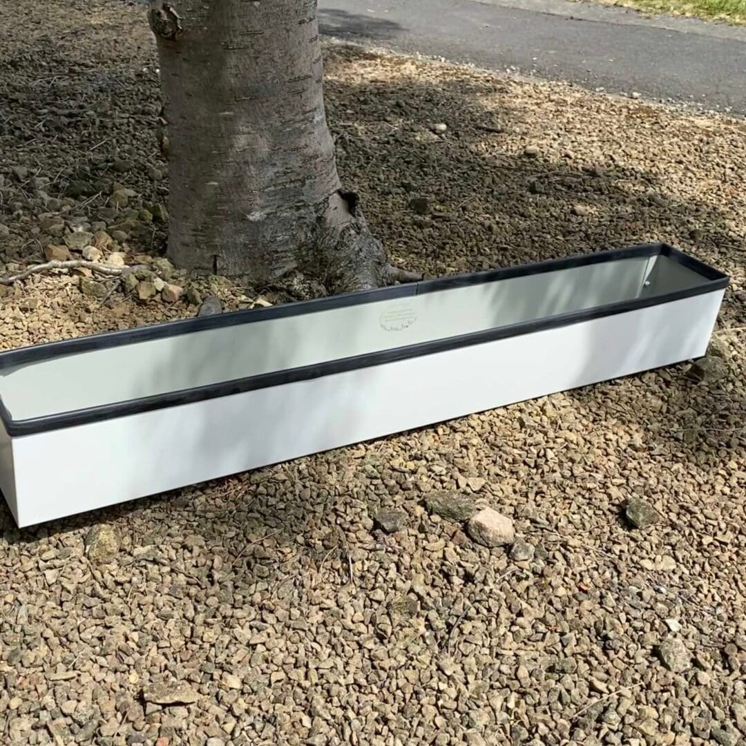 white metal window sill planter