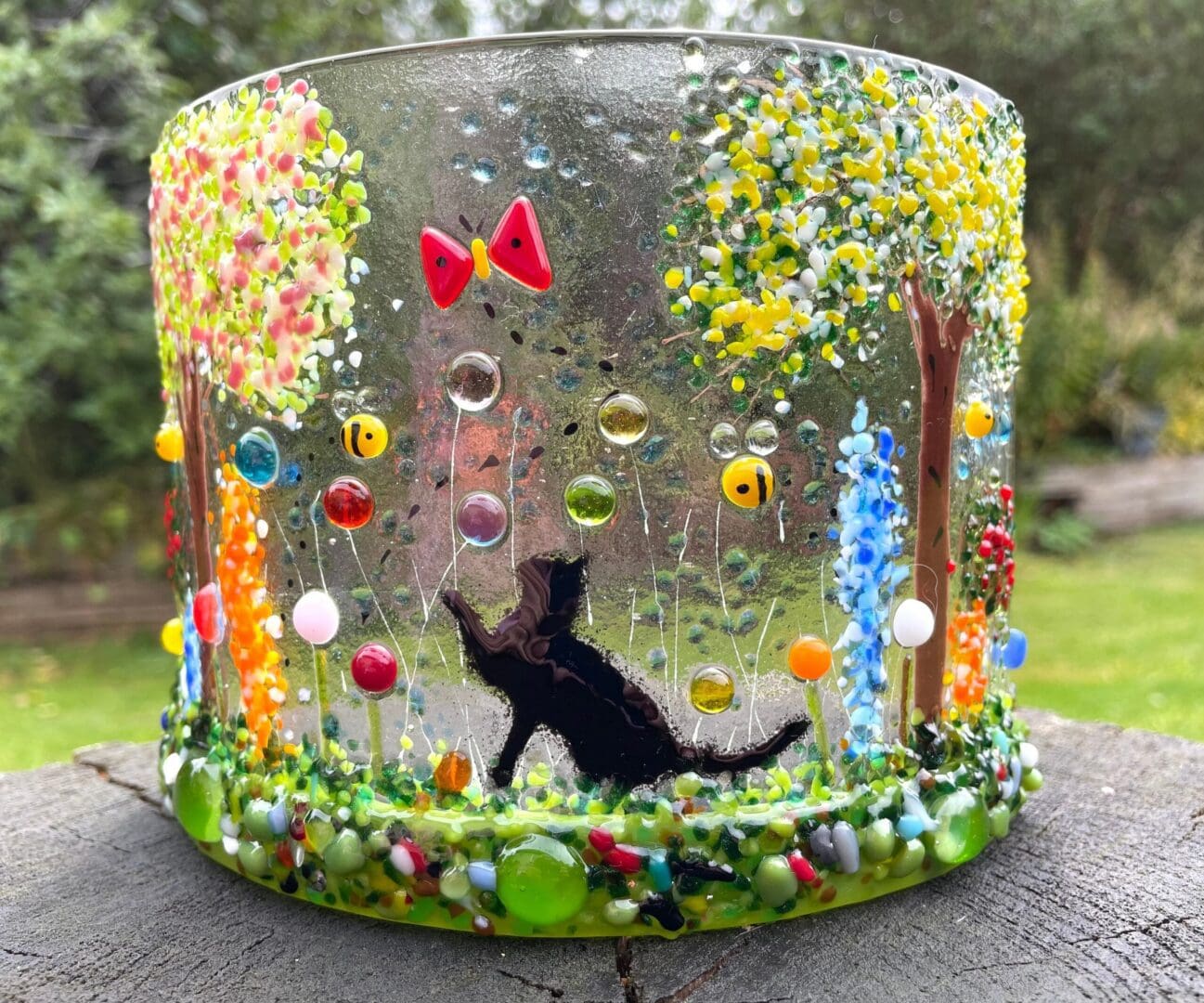 Cat, Bees, flowers and cherry blossom curve-candle curve-cat playing in flower meadow