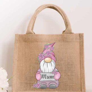 Small natural jute tote bag featuring a pink floral gnome holding a white sign that says Mum in elegant black script.