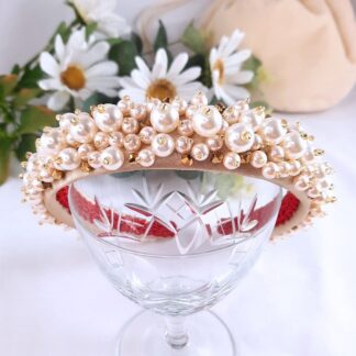 Wide band headband covered in pearls and gold crystals