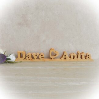 Personalised wooden couples name sign with heart detail between names