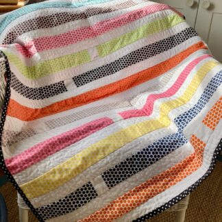 Modern spot strip baby quilt