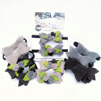 Black and grey bows and roses set on a hair elastic