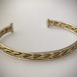 silver bangle with central brass twist
