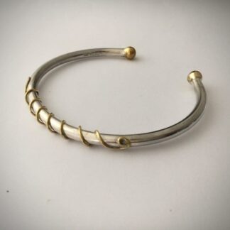 silver and brass bangle