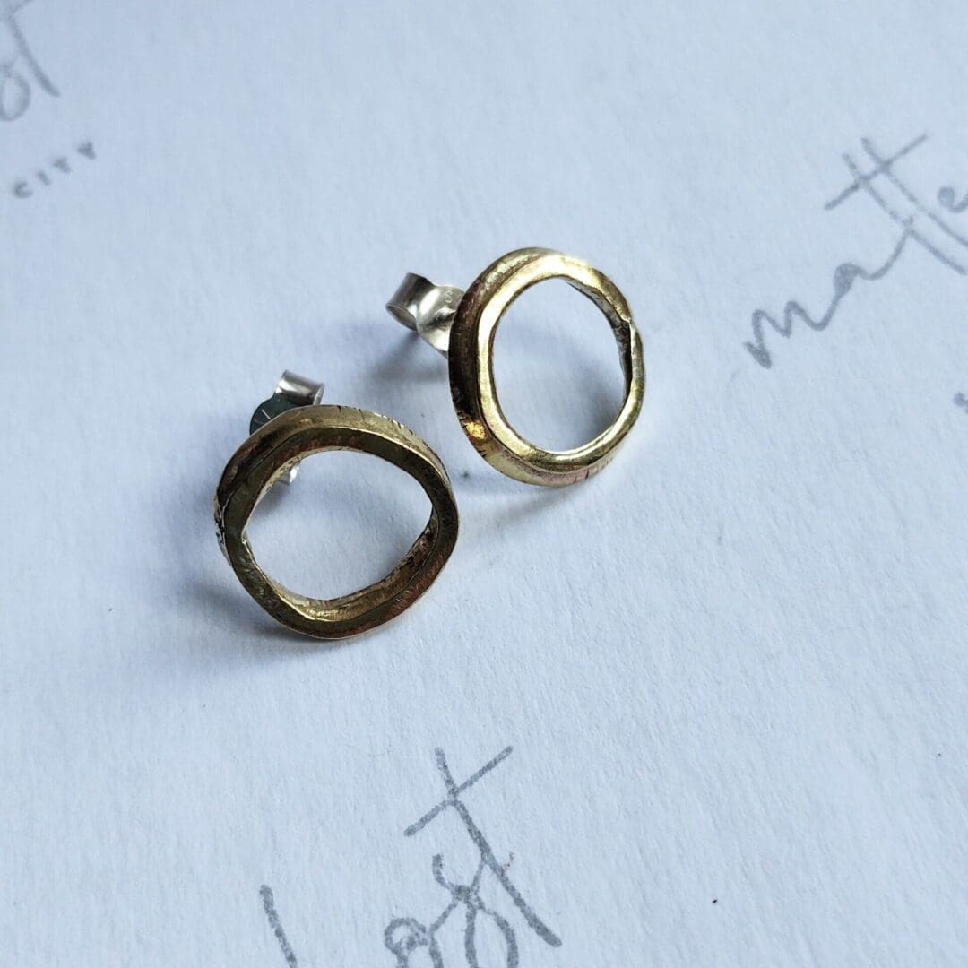 Sterling silver and brass hoop stud earring
