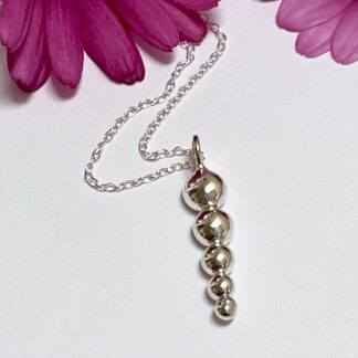 Silver descending bubble necklace made from recycled silver