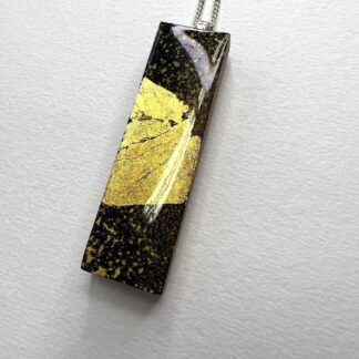 a black a gold sparkle necklace