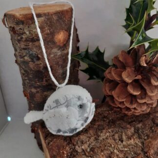 a hand stitched felt and fabric bird christmas decoration, white and silver