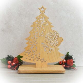 Handcrafted wooden Christmas tree with intricate scroll saw pattern and Dove of Peace detail