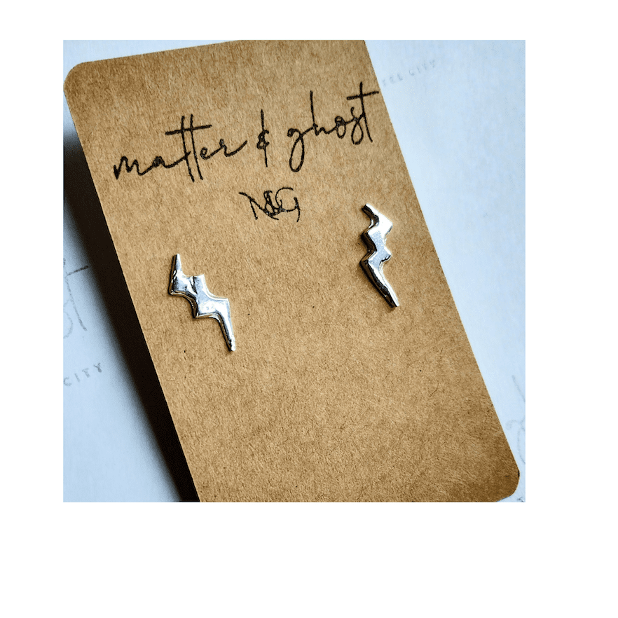 a pair of silver lighting bolt stud earrings