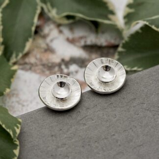 Argentium sterling silver concave layered disc stud earrings with a sun ray embossed surface texture