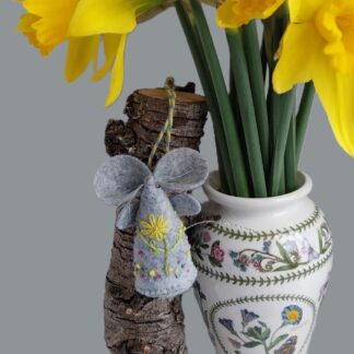 An embroidered felt Mouse with spring Flowers
