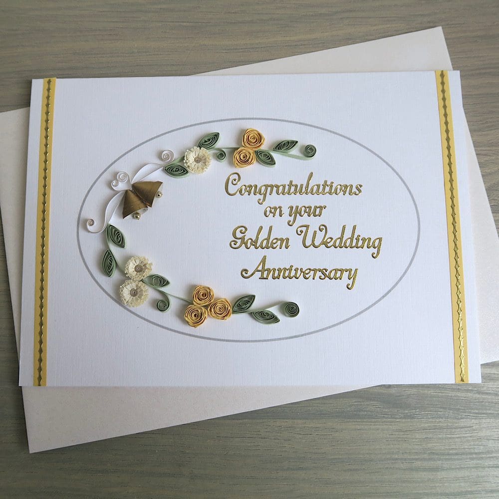 Handmade olden wedding card with quilled flowers and bells