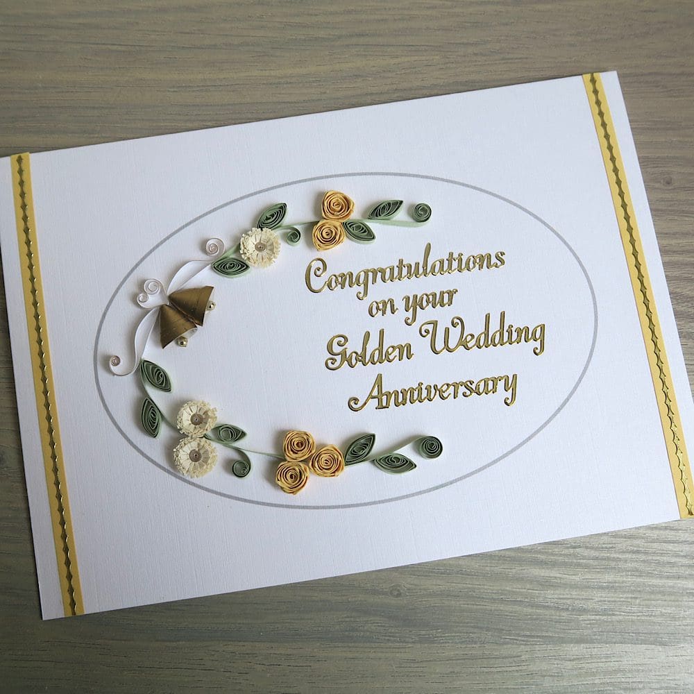 Handmade olden wedding card with quilled flowers and bells