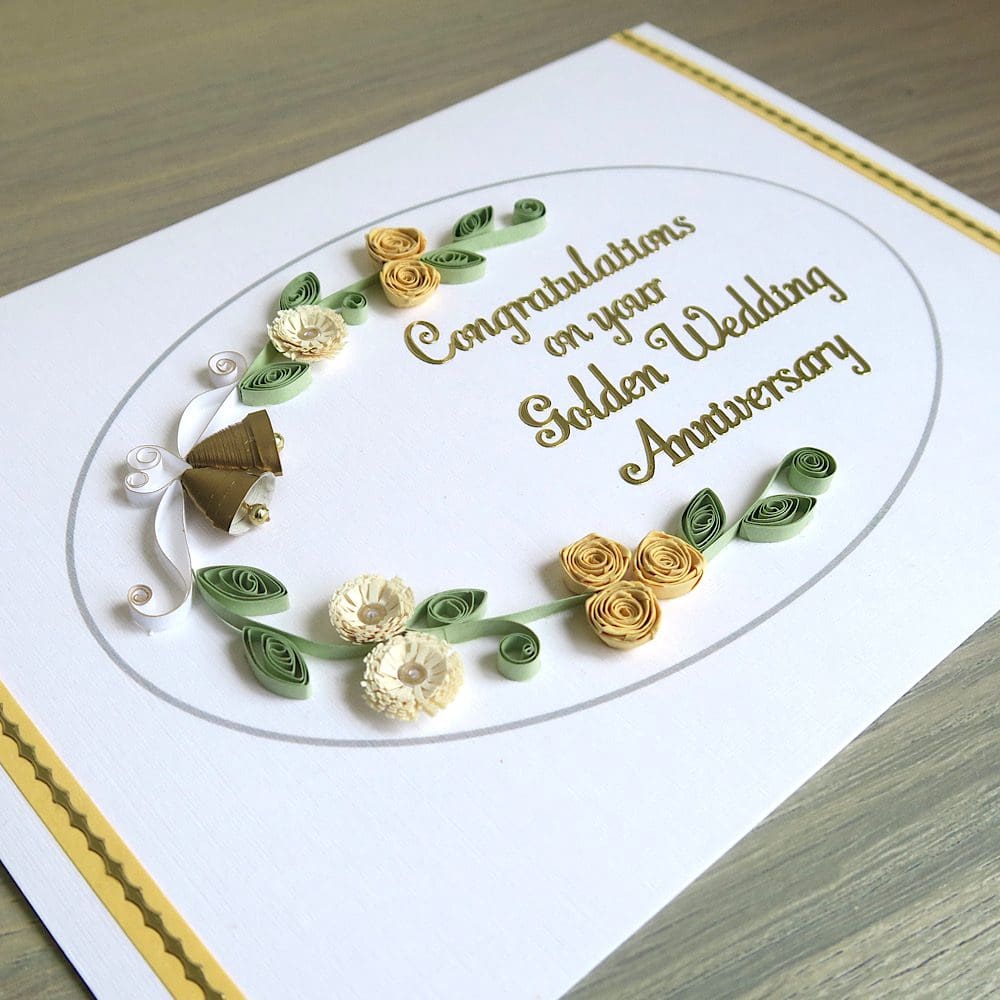 Handmade olden wedding card with quilled flowers and bells