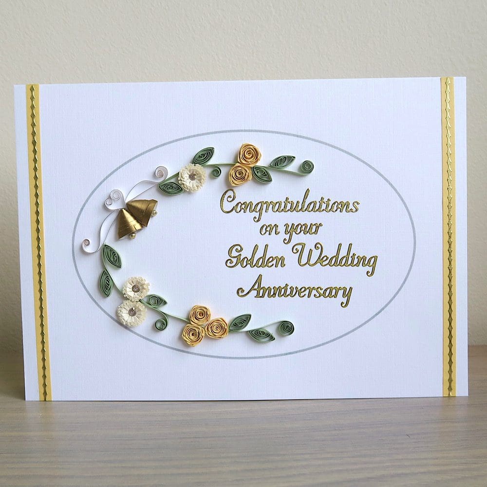Handmade olden wedding card with quilled flowers and bells