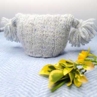 Unique looking baby hat with tassels for fashionable babies.