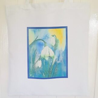 White tote bag with snowdrop artwork