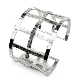 Sterling silver textured open cuff bracelet isolated on a white background