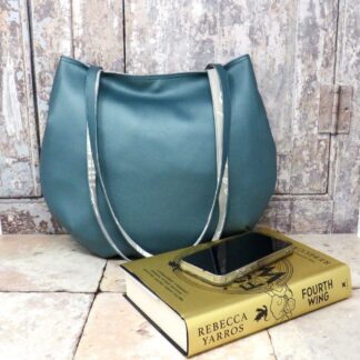A teal slouch bag in a metallic faux leather