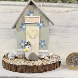 Soft Green Floral Mini Wooden Beach Hut Scene with Seashells and Seagull