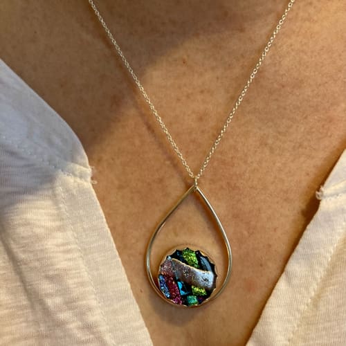 Colour raindrop necklace being worn