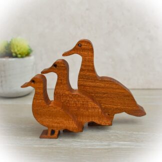 Handcrafted family of three wooden ducks made from Sapele wood