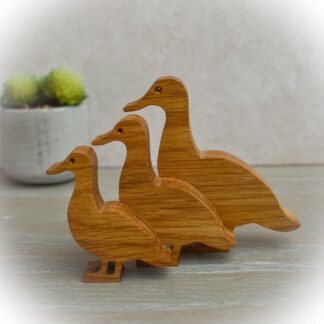 Oak duck family arranged as a decorative home display.
