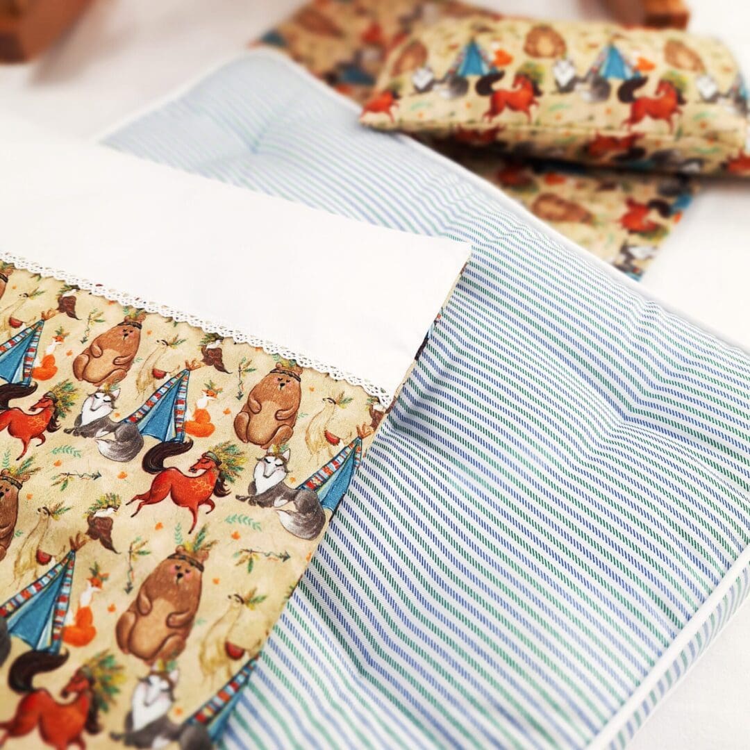 Dolls bedding set with animals for bedtime play.