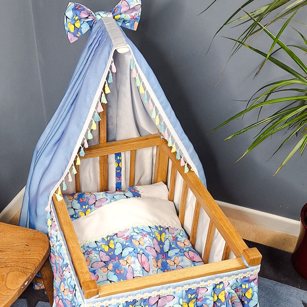 Inside the luxury toy cot suitable for dolls and teddies.