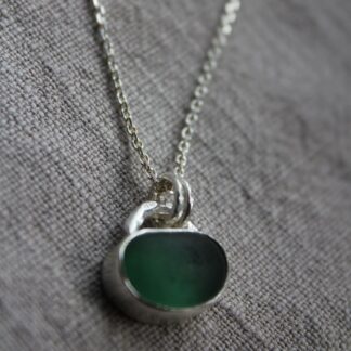 Deep green seaglass jellybean pendant in sterling silver