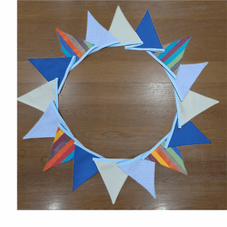 Blues, greens and stripes create perfect boys bedroom bunting.