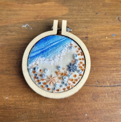 Embroidered shoreline of pebbles and seashells mini hoop brooch 4cm. - Image 2
