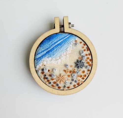 Embroidered shoreline of pebbles and seashells mini hoop brooch 4cm. - Image 3