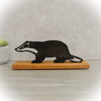 Handcrafted wooden Badger made from Tulip wood on hardwood base