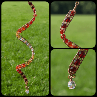 handmade copper spiral wind spinner in red, orange and yellow