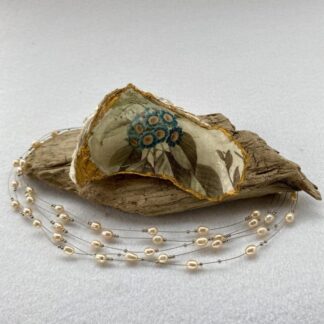 A handcrafted Decoupaged Oyster Shell