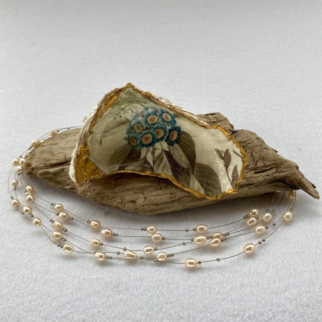 A handcrafted Decoupaged Oyster Shell